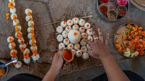 Rice pinds with flowers and darbha being offered in shradh for ancestors