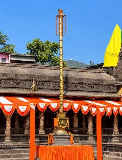 Dhwaja stambh decorated in saffron for Simhastha Kumbh Dhwajarohan at Kushavarta, Trimbakeshwar