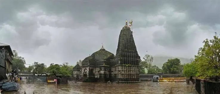 Trimbakeshwar Jyotirlinga temple near Nashik, with its black stone shikhar under monsoon clouds