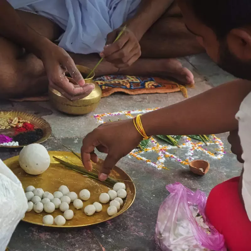 Pinds being prepared on a brass plate with darbha grass during Tripindi Shradh vidhi